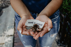 outstreched hand with change